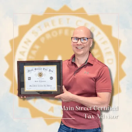 Scott Letourneau holding Main Street Certified Tax Advisor certificate